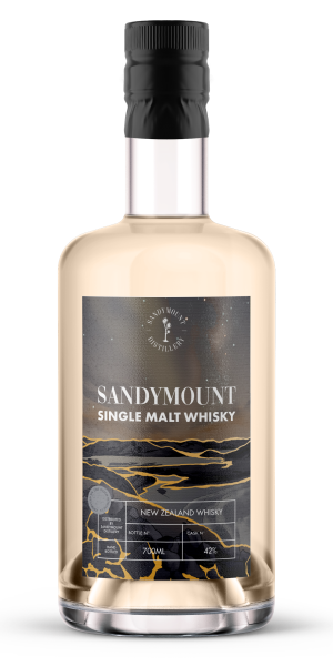 A glass bottle with whisky in it and a label on the front titled "Sandymount Single Malt Whisky". The label is a dark starry night backdrop.